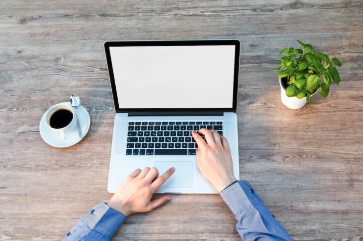 A lawyer using a laptop to research AI tools
