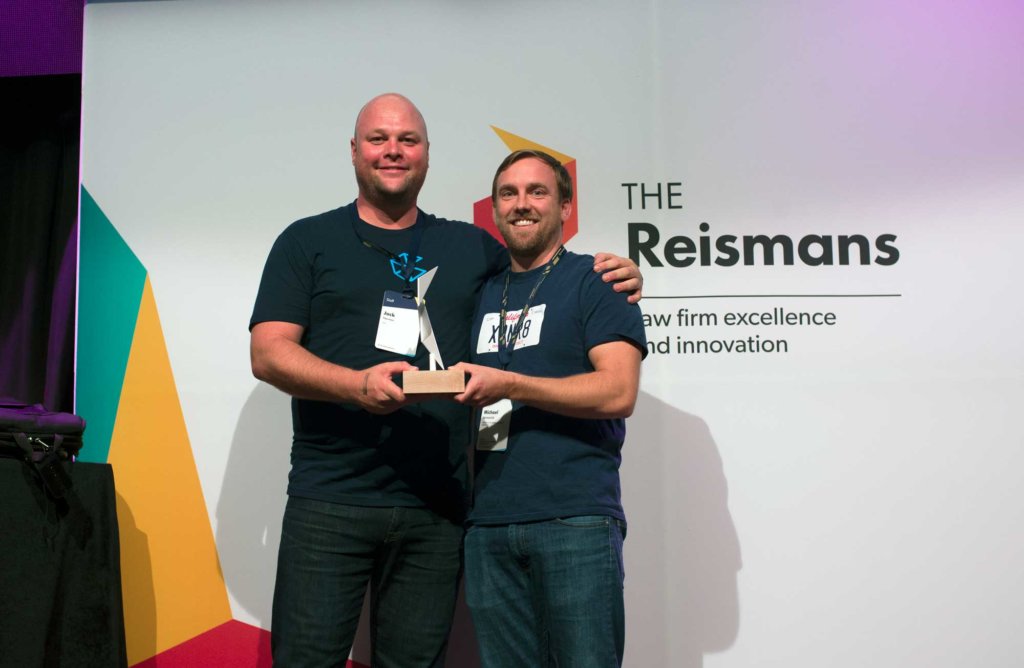 Clio CEO Jack Newton and winner Managing Attorney at the California Innocence Project Michael Semanchik at The Reismans customer recognition program event.