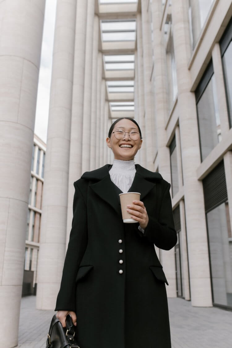 happy lawyer holding a cup of coffee