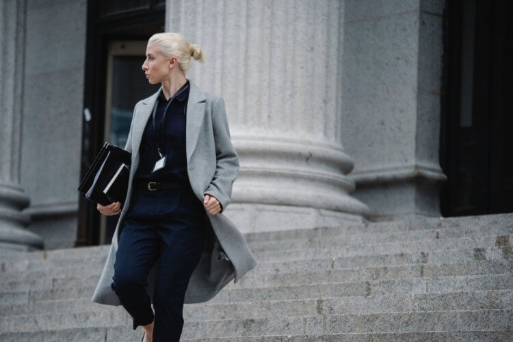 Environmental lawyer walking down courthouse steps