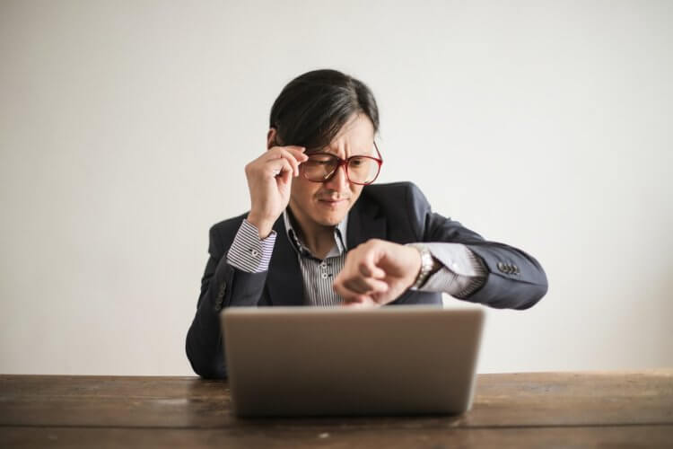 Lawyer checking deadline on a watch