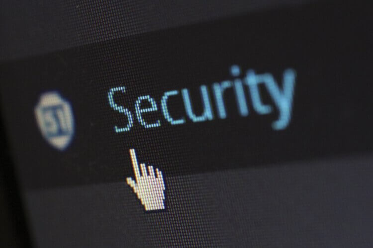 A close up of a computer screen with the cursor pointing to the word "security".