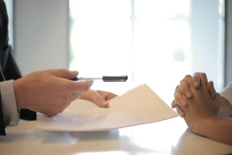 Lawyer filling out an MC-050 form for client